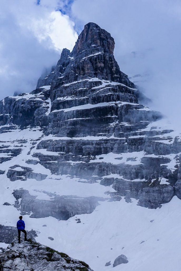 Gazing up at Punta Massari and Cima Brenta poking through the cloudy sky