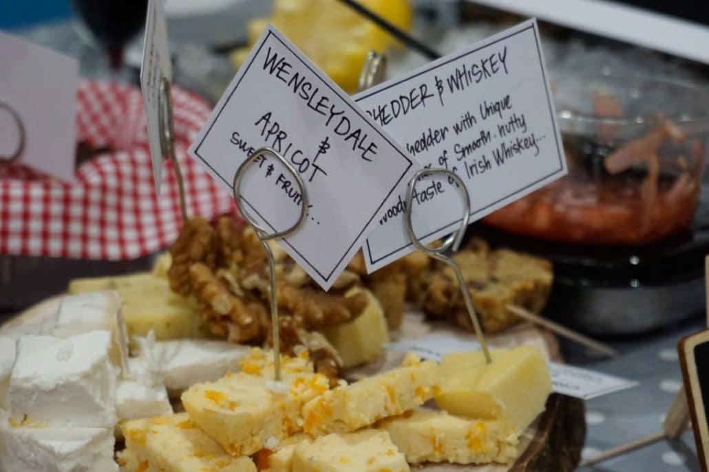 A plate of wensleydale and apricot cheese with walnuts on Leeds Food Tour