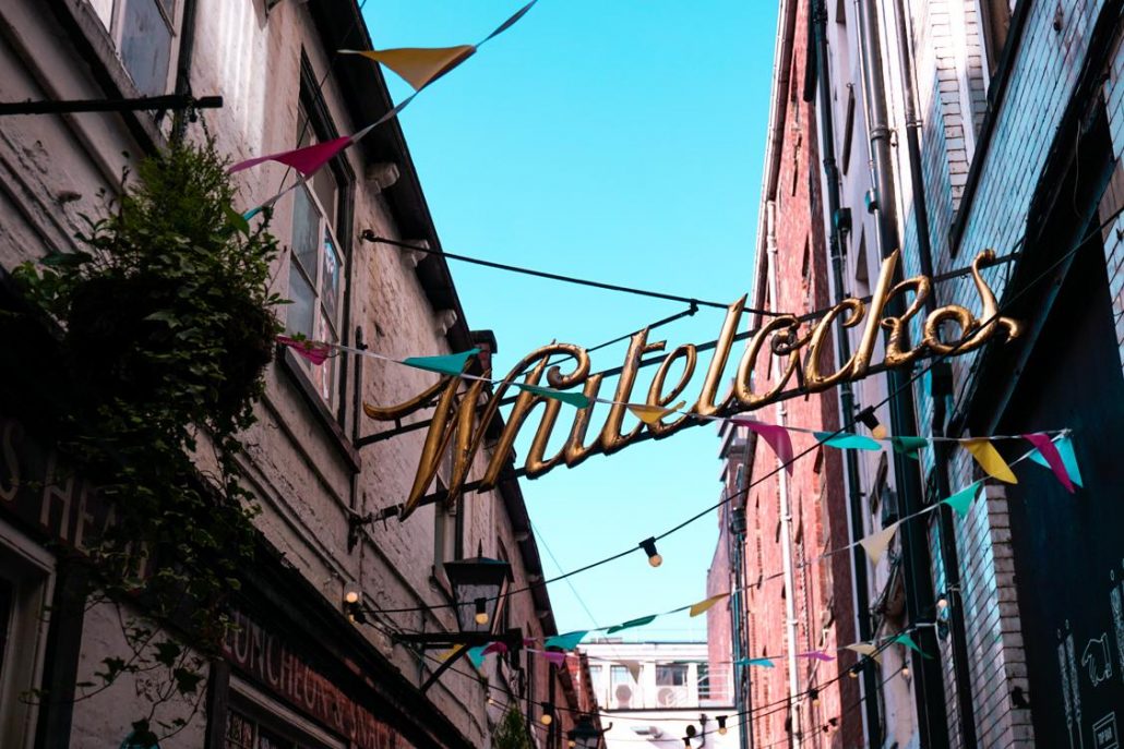 The Golden Whitelocks metal sign stretching across the tiny cobbled street leading to this special pub