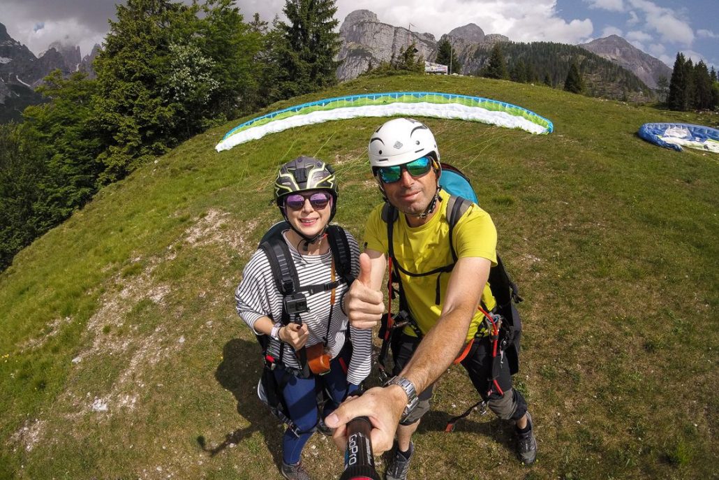 Alice Teacake and her paragliding instructor Stevano giving the thumbs up before taking off