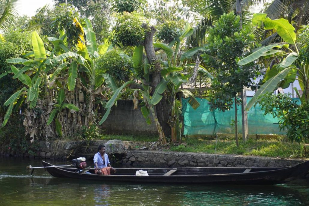 Man on boat in river in India