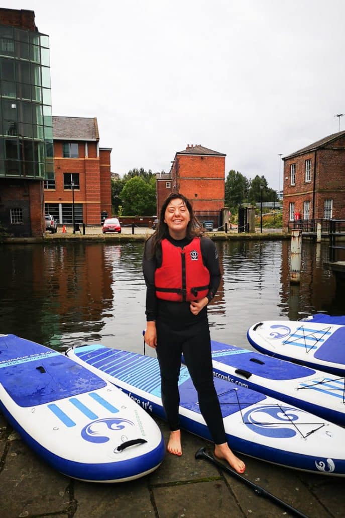 Jessica in your ear getting ready to go stand up paddleboarding