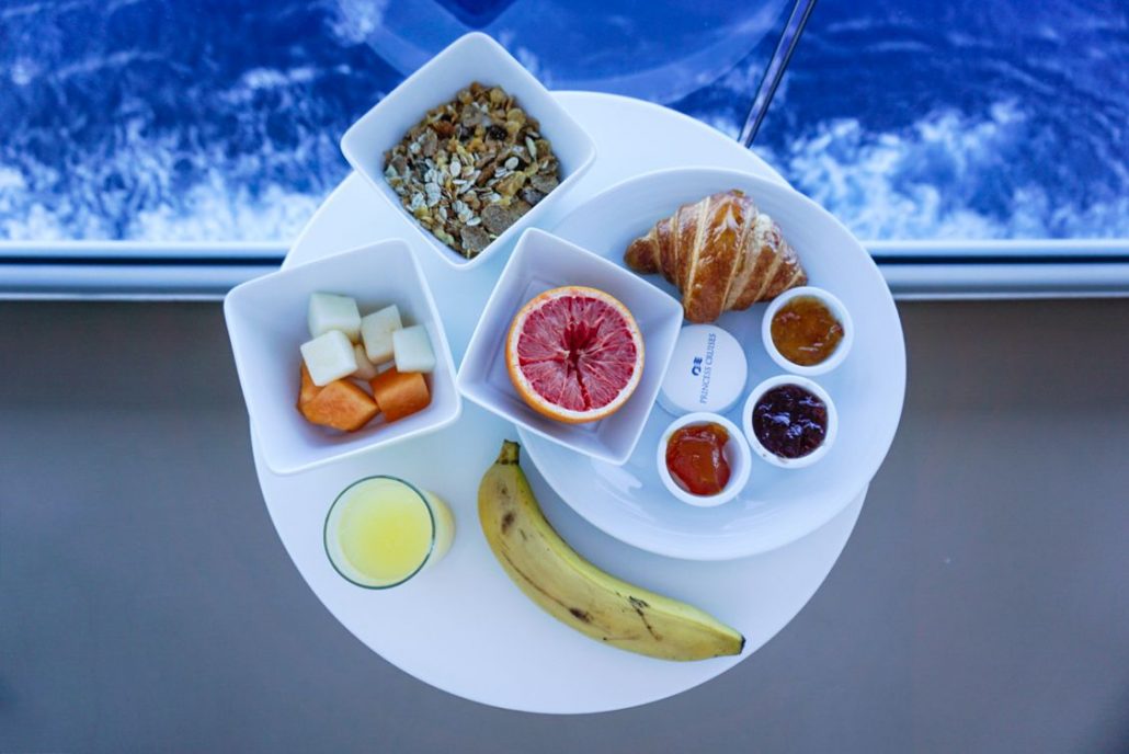 Stateroom breakfast consisting of fruit, muesli, a croissant, jams, butter, grapefruit, an orange juice and a banana - all on the Princess MedallionClass App