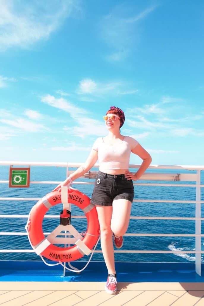 Alice Teacake wearing her Ocean Medallion aboard the Sky Princess as a clip on her shorts