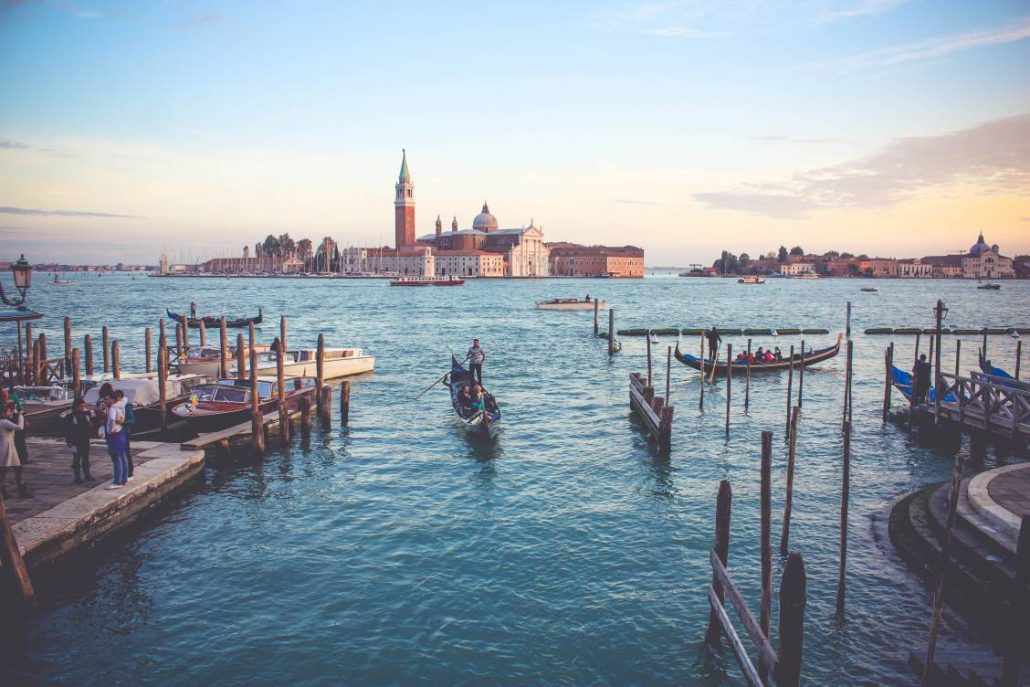 Photo of a gondola pulling into the docks in Venice