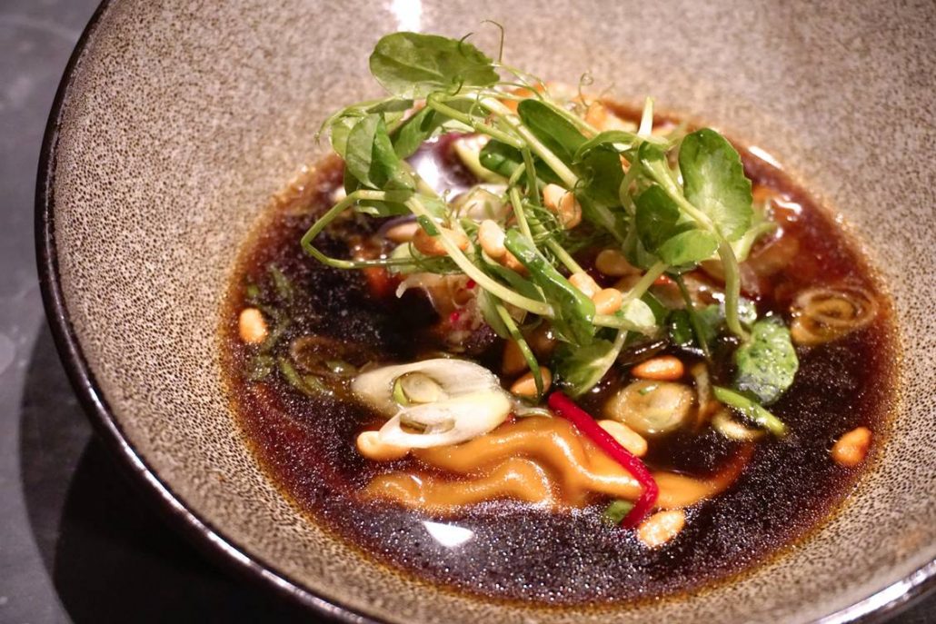 shiitake dumplings in mushroom broth with pickles