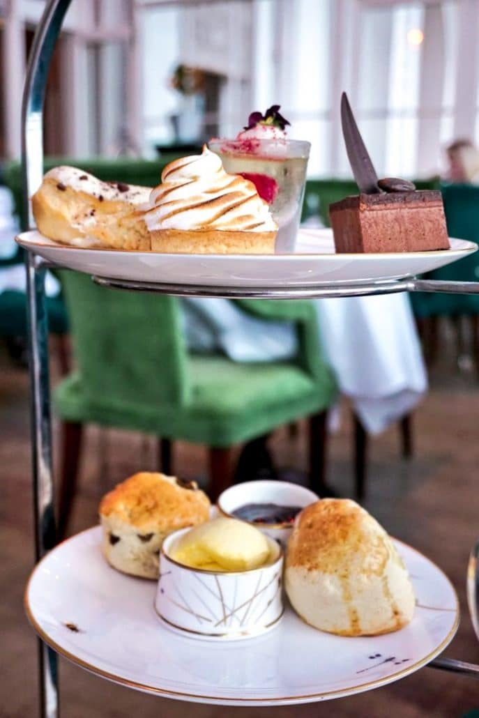 Two plates of delicious cakes and scones at The Grand Hotel in Brighton